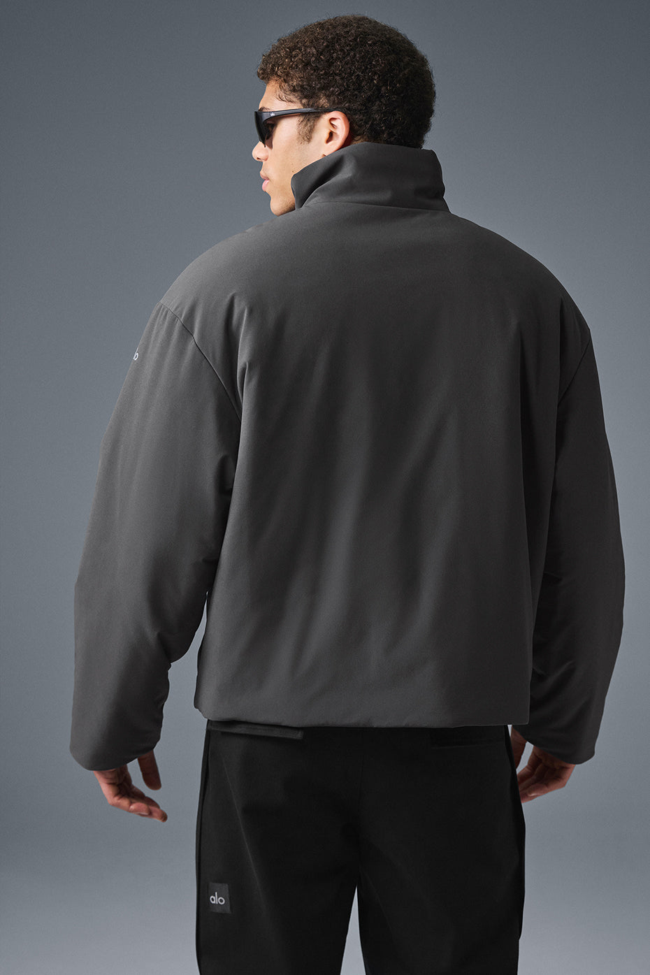 Close-up of jackets textured fabric and stand-up collar