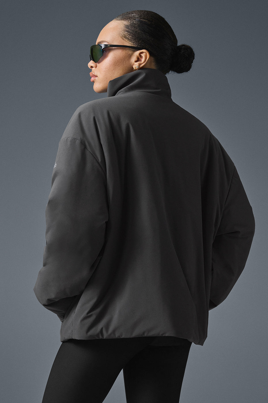 Close-up of the lightweight puffer jackets collar and fabric.
