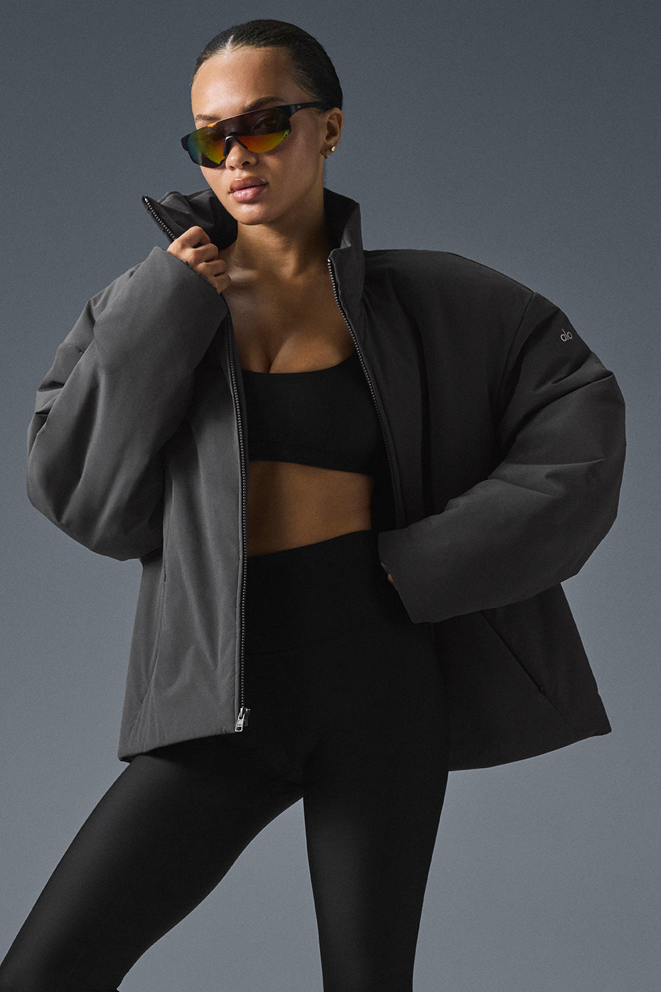 Stylish lightweight down jacket on a model in a city setting.