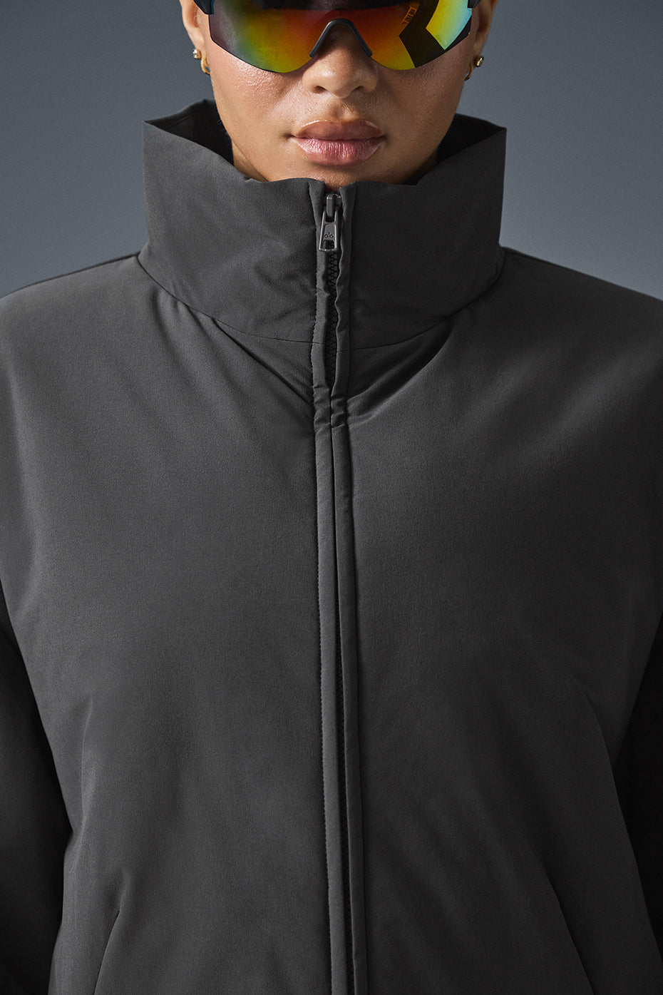 Close-up of the lightweight puffer jackets collar and fabric.
