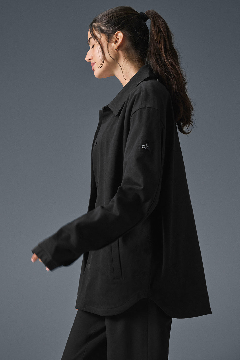 Close-up of the contoured sleeve seaming on the mens sueded jacket