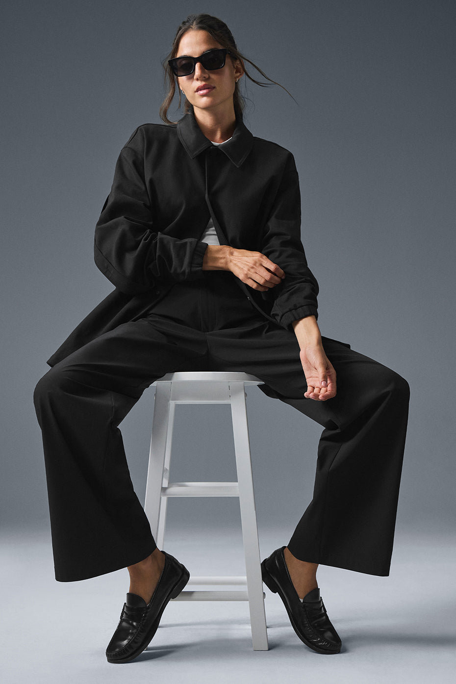 Model wearing the black bomber jacket styled for casual outings