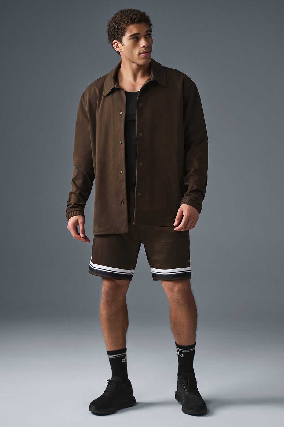 Side angle of the stylish outerwear jacket, highlighting the unique seaming.