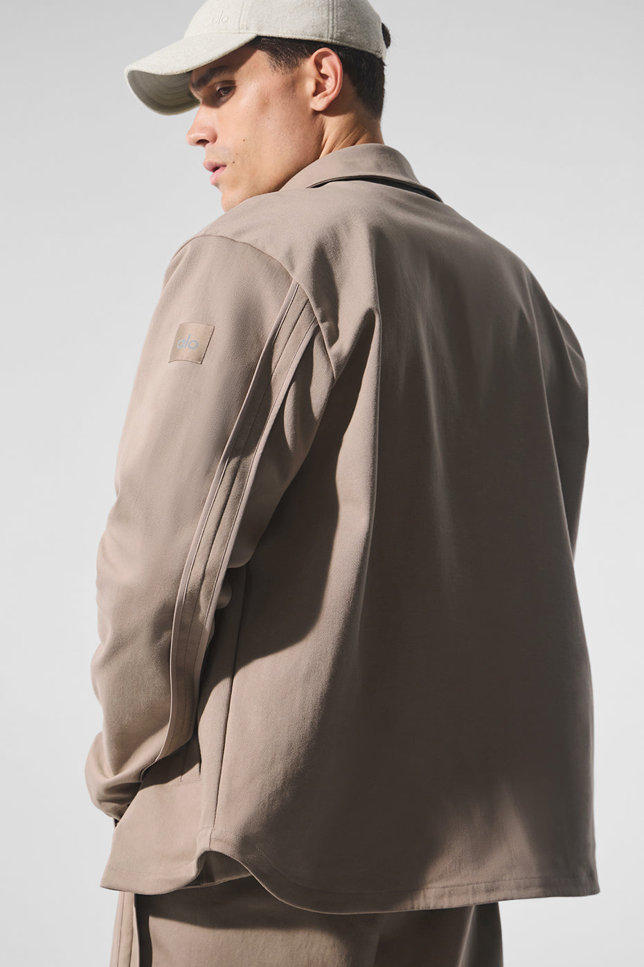 Close-up of the elasticated cuffs and contoured seaming on the back of the sleeves