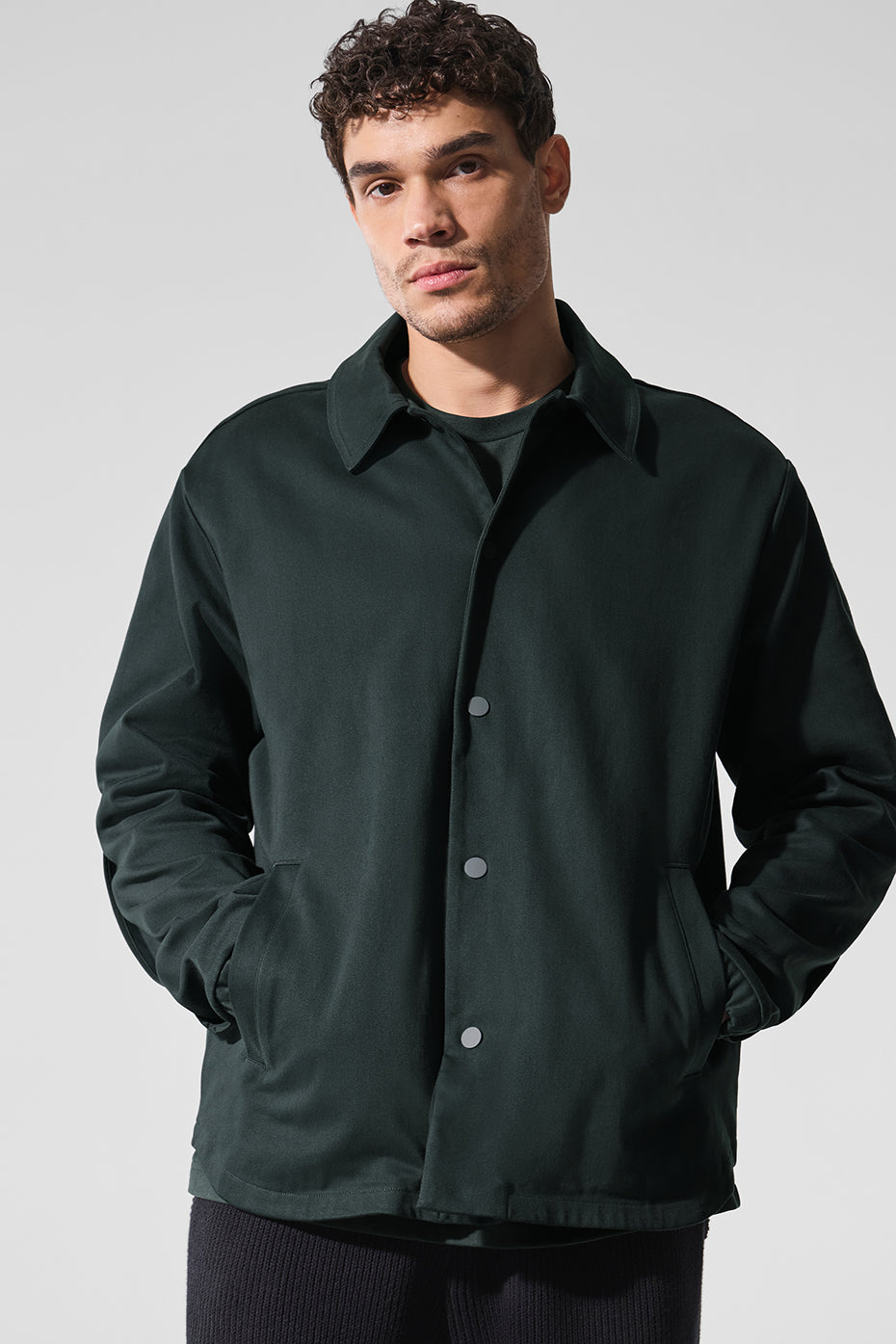 Front view of charcoal green sueded jacket for men.