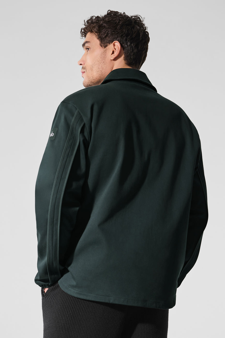 Side angle of mens sueded jacket showcasing its fit.