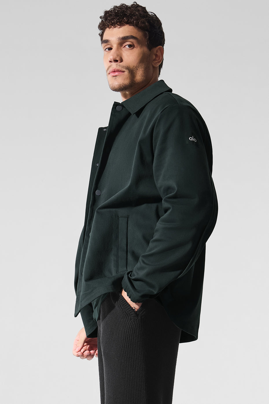 Back view highlighting the contoured seaming of the jacket.