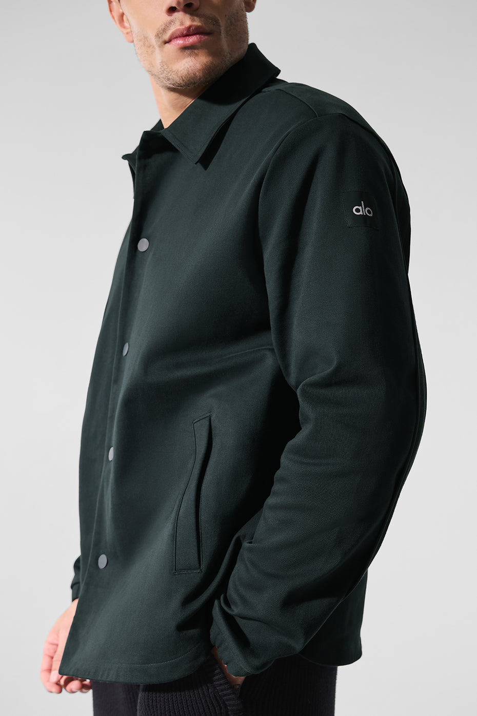 Front view of charcoal green sueded jacket for men.