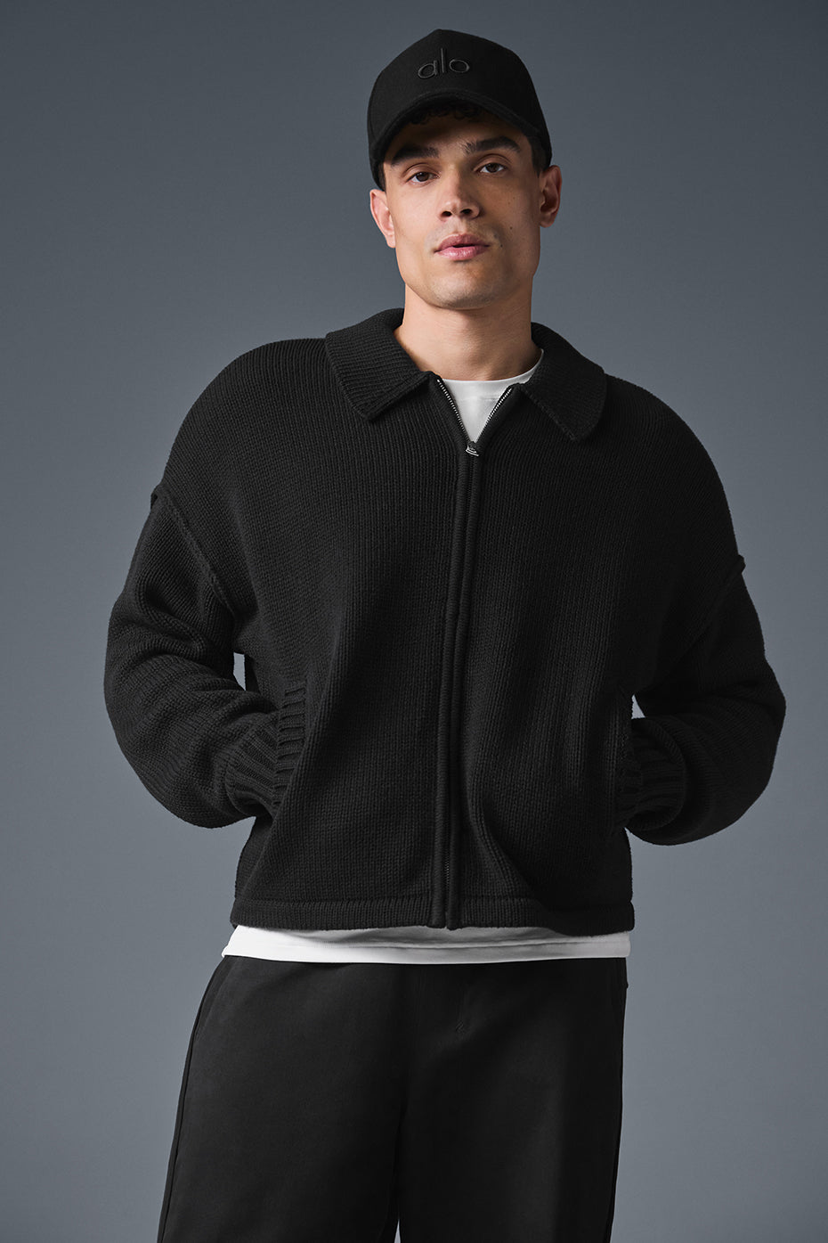 Close-up of Heritage full zip sweater in black with sleek collar detail