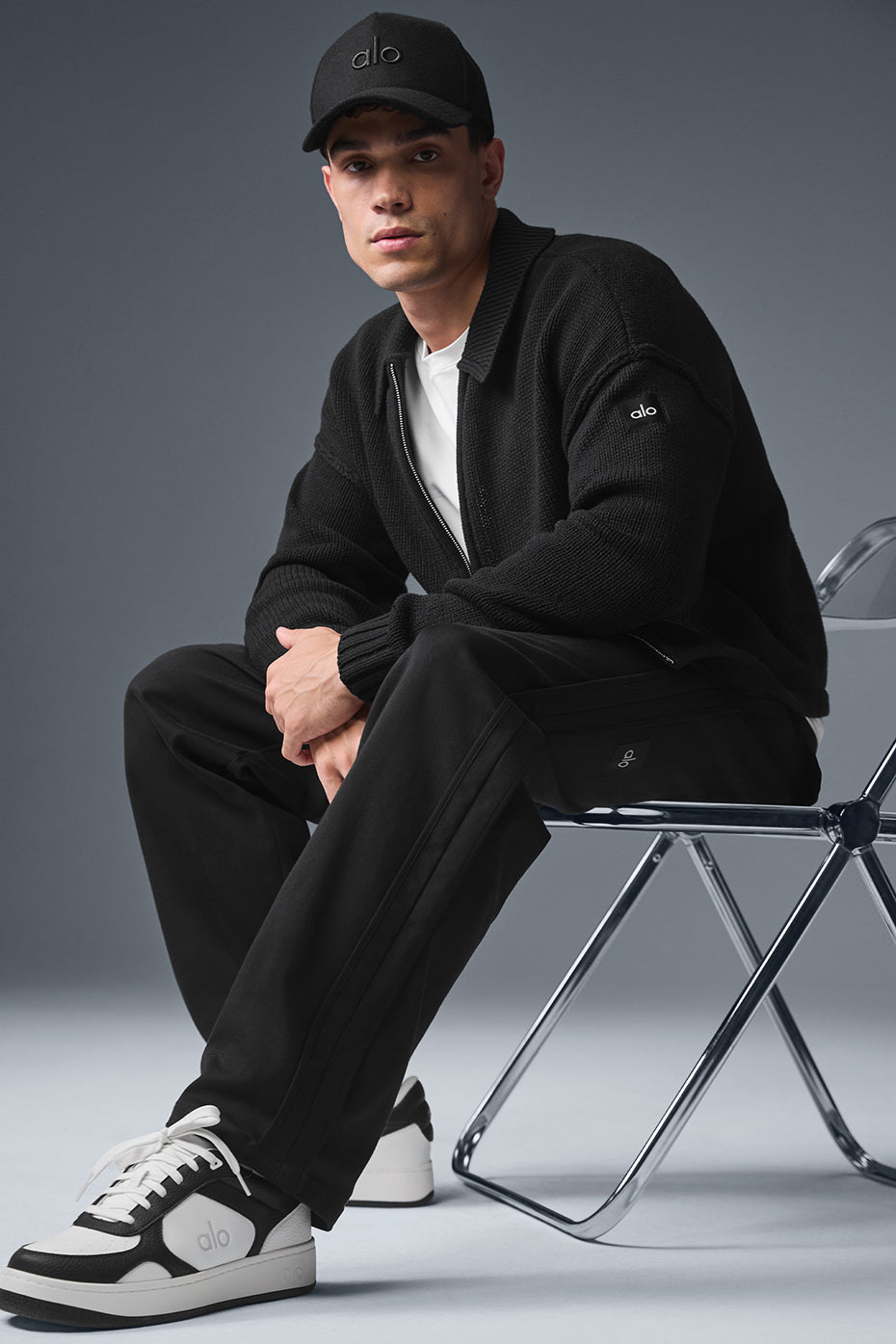 Close-up of Heritage full zip sweater in black with sleek collar detail