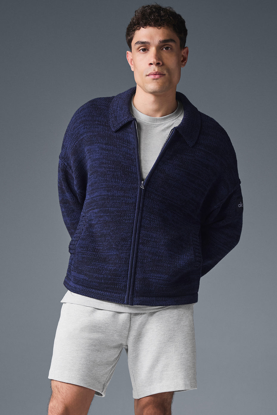Close-up of the Heritage navy multi full zip sweater showing the sleek collar and texture