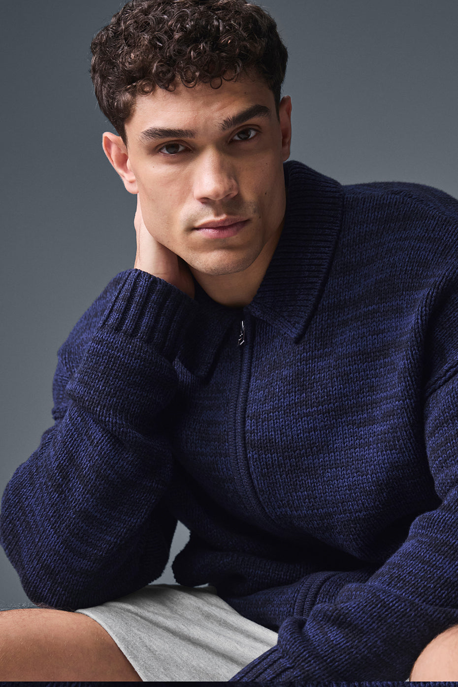 Close-up of the Heritage navy multi full zip sweater showing the sleek collar and texture