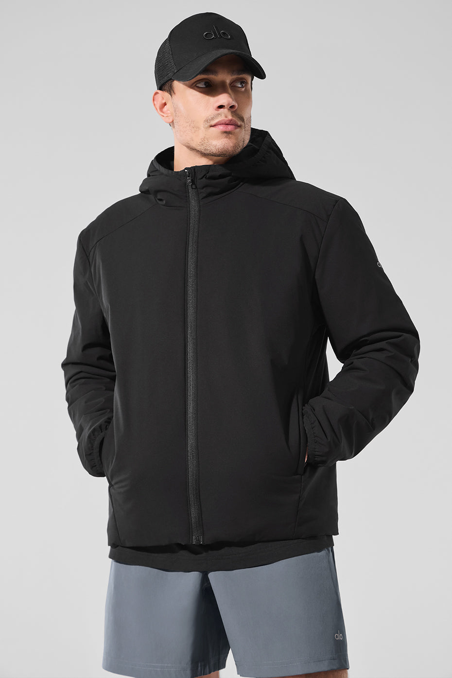 Front view of the essential black puffer jacket for men, showcasing its stylish design.