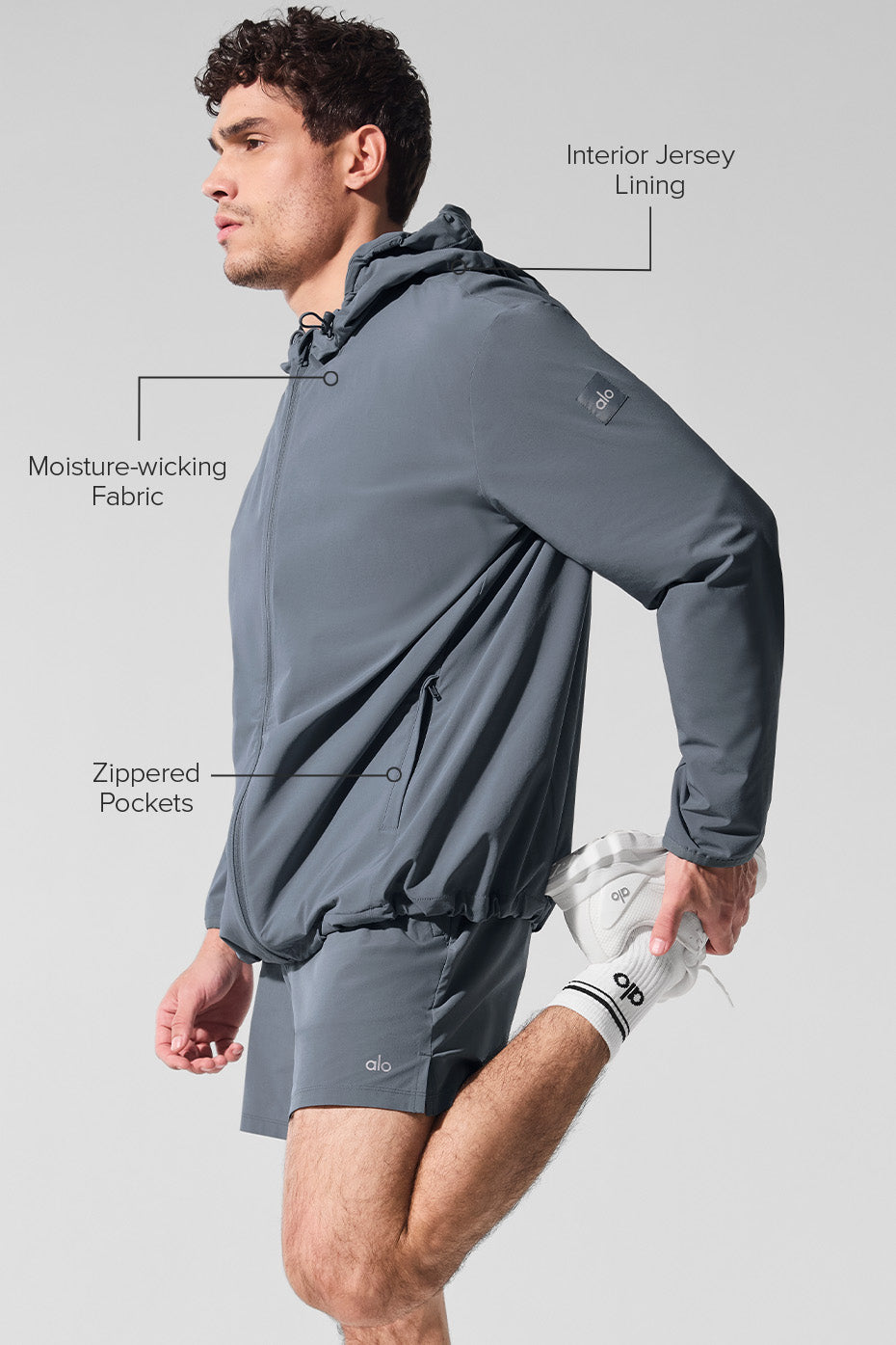 Man jogging in the moisture-wicking jacket on a brisk morning.
