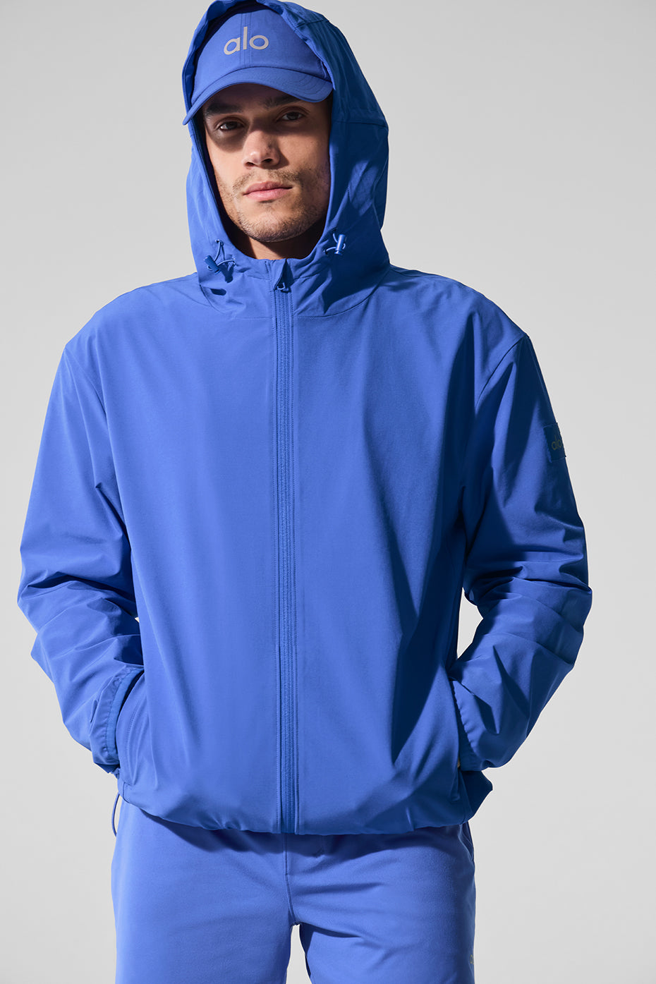 Side view showcasing the moisture-wicking fabric of the performance jacket.
