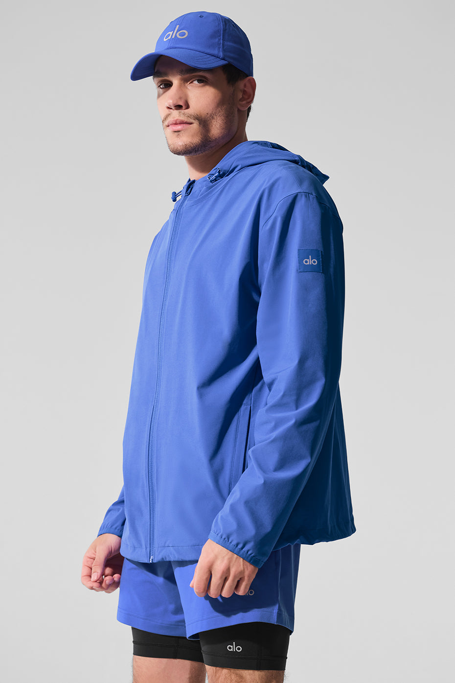 Front view of the waterproof running jacket in Marathon Blue, ideal for running.