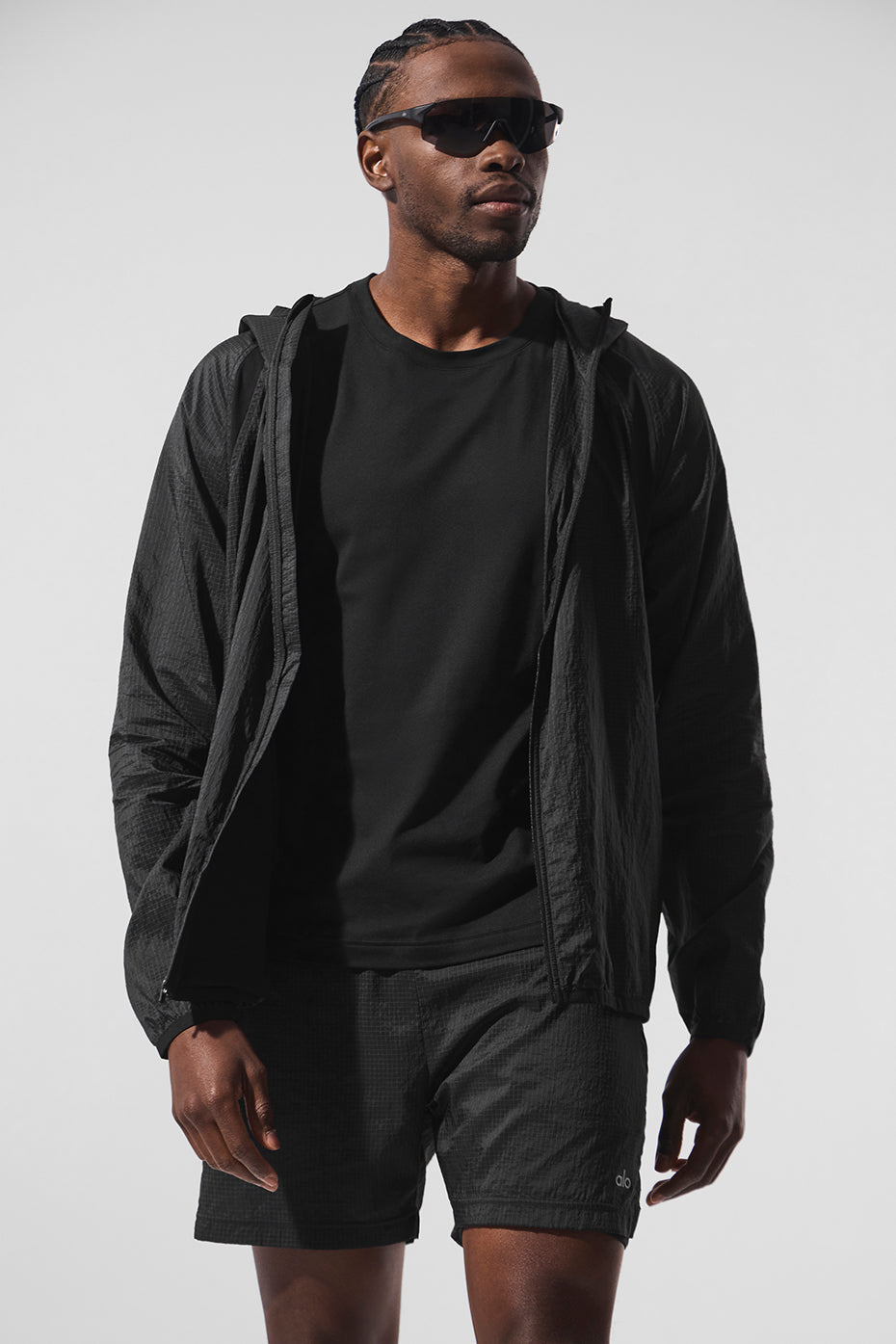 Front view of black lightweight jacket for daily training