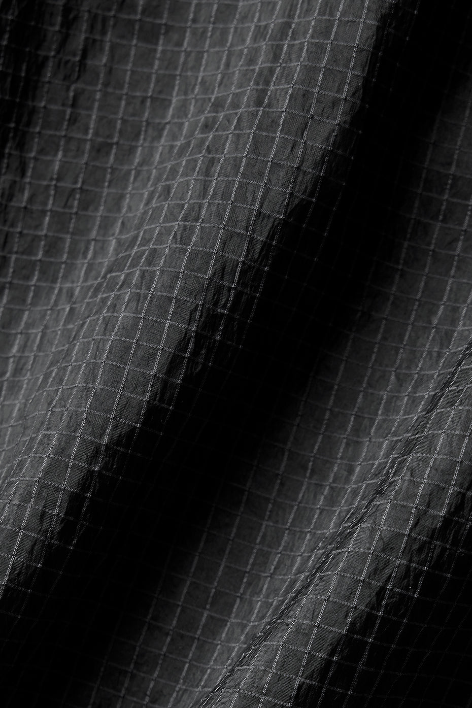Back mesh detail of breathable jacket on male model outdoors