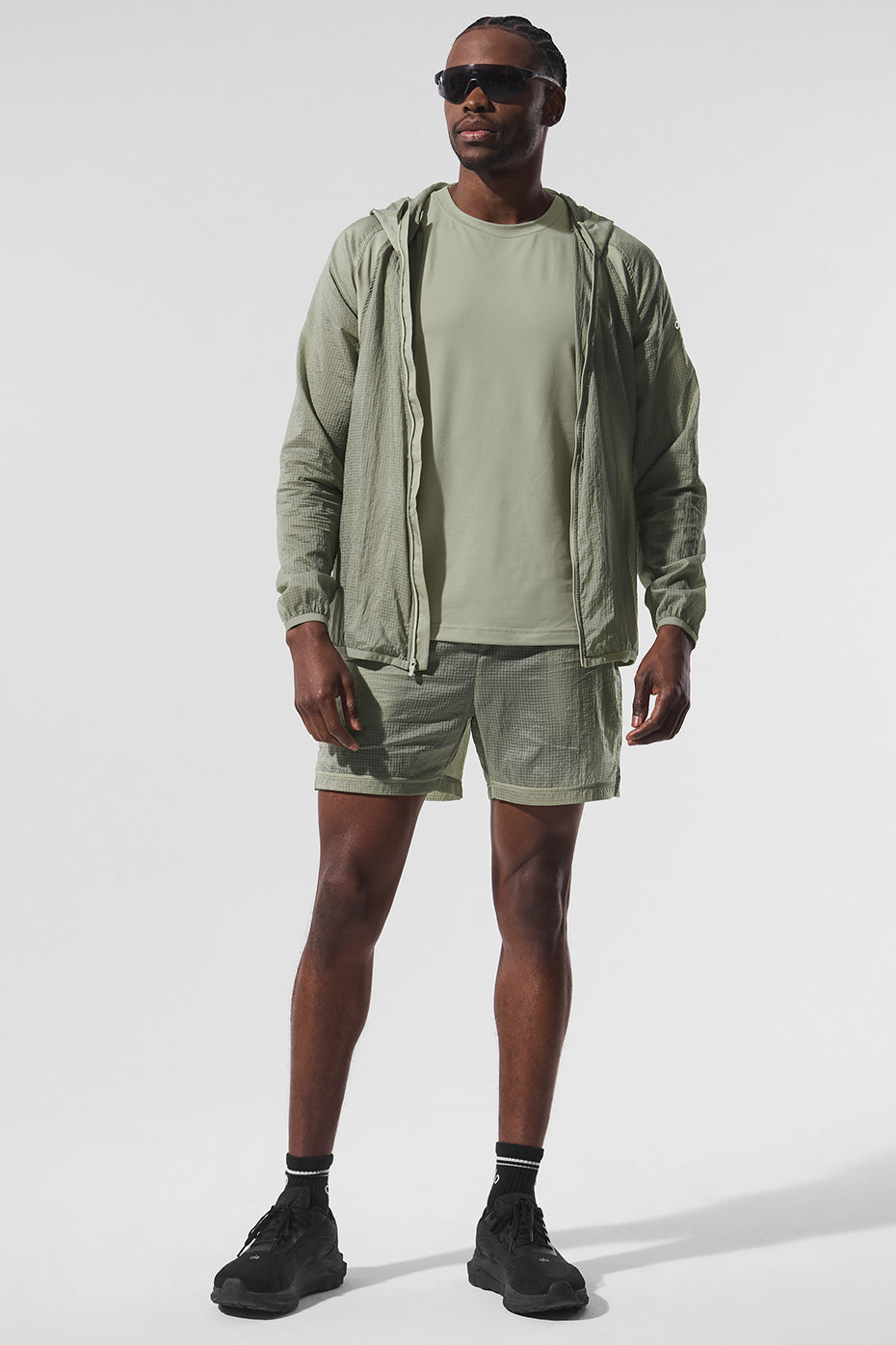 Front view of the lightweight running jacket in limestone, ideal for morning runs.