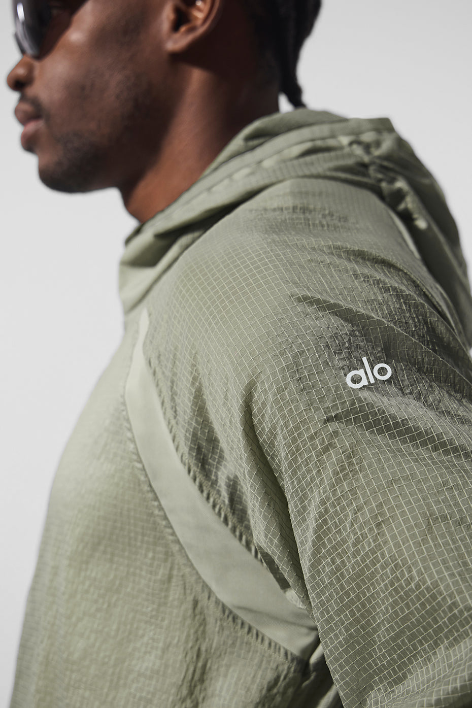 Front view of the lightweight running jacket in limestone, ideal for morning runs.