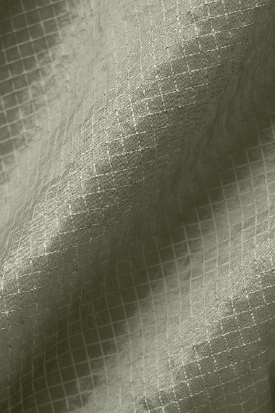 Side view showcasing the breathable mesh details of the running jacket.