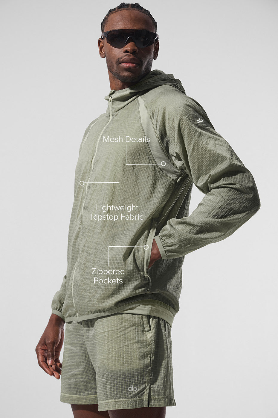 Side view showcasing the breathable mesh details of the running jacket.