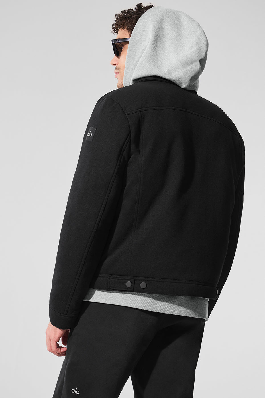 Model wearing the black bomber jacket, styled for a casual day out.