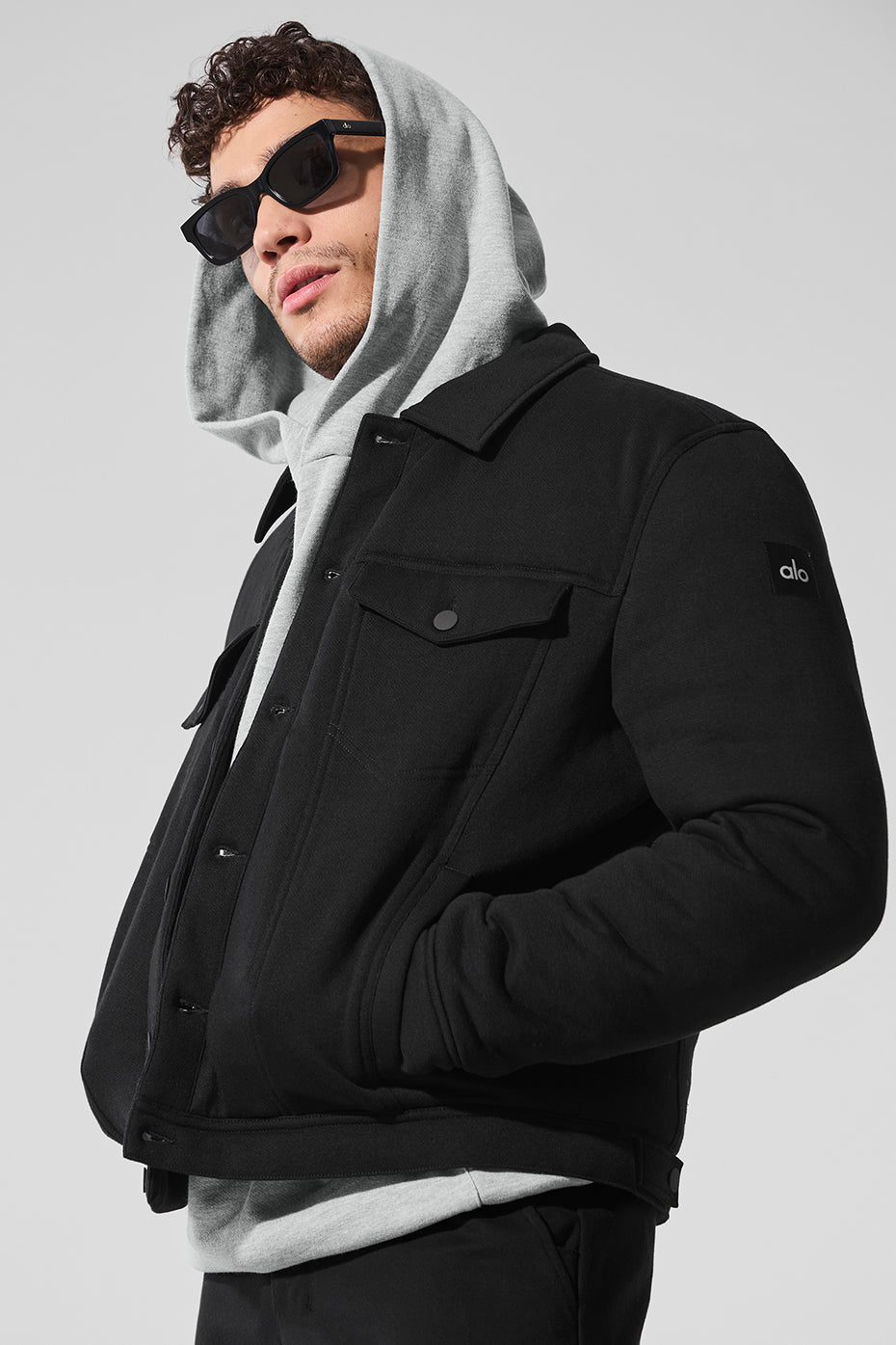 Front view of the Chill Ease Trucker Jacket in black, showcasing its classic design.