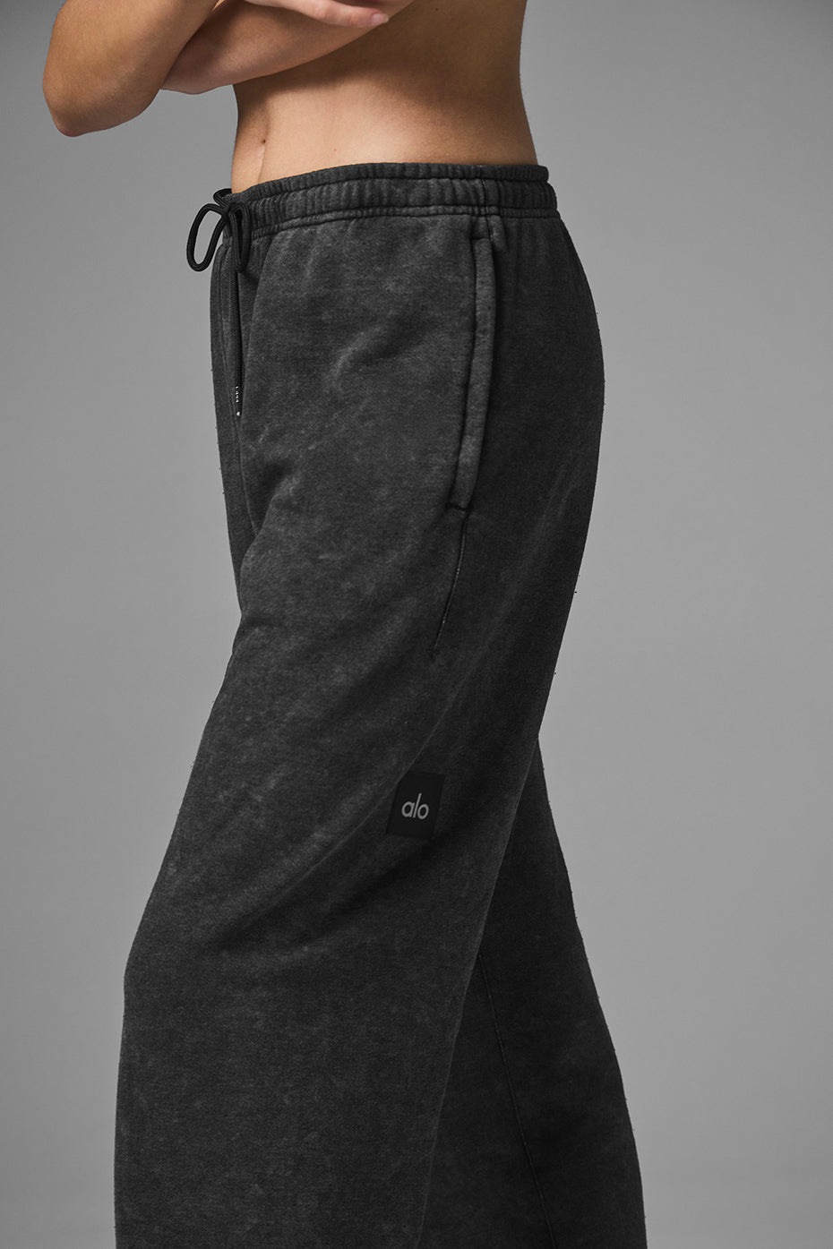 Close-up of wide leg sweatpants waistband and zippered pocket