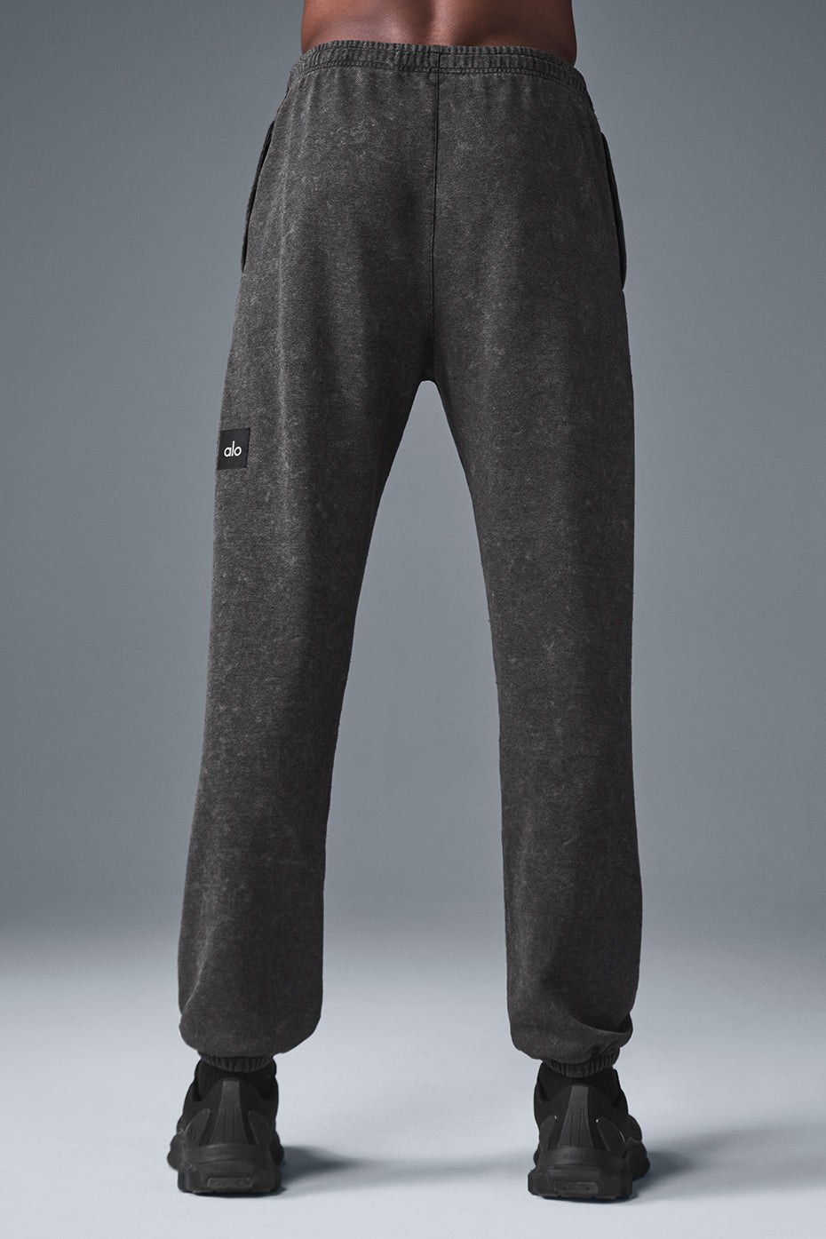 Side view showcasing zippered pockets and relaxed fit of camo sweatpants alternative