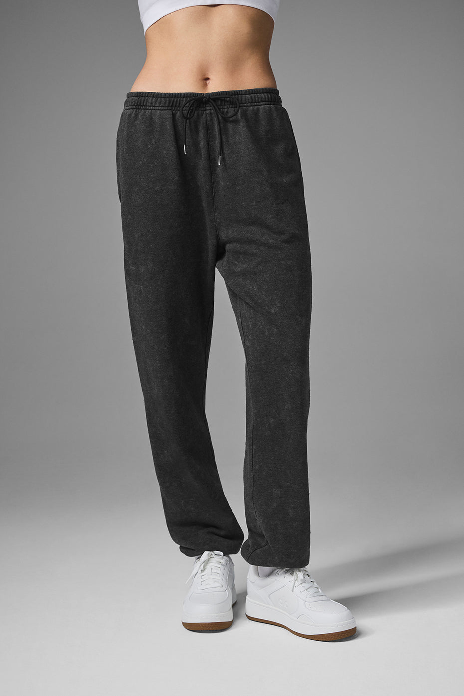 Side angle of baggy sweatpants styled with matching hoodie