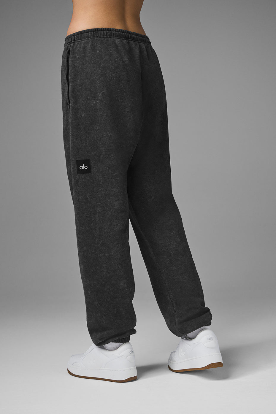 Front view of black joggers with vintage wash and cuffed hems