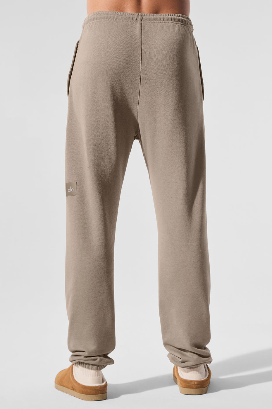 Model styling vintage wash sweatpants with casual sneakers