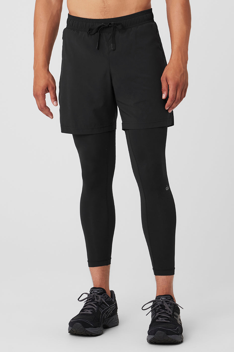 Front angle of Momentum DualFlex pants showing ribbed panels and waistband fit