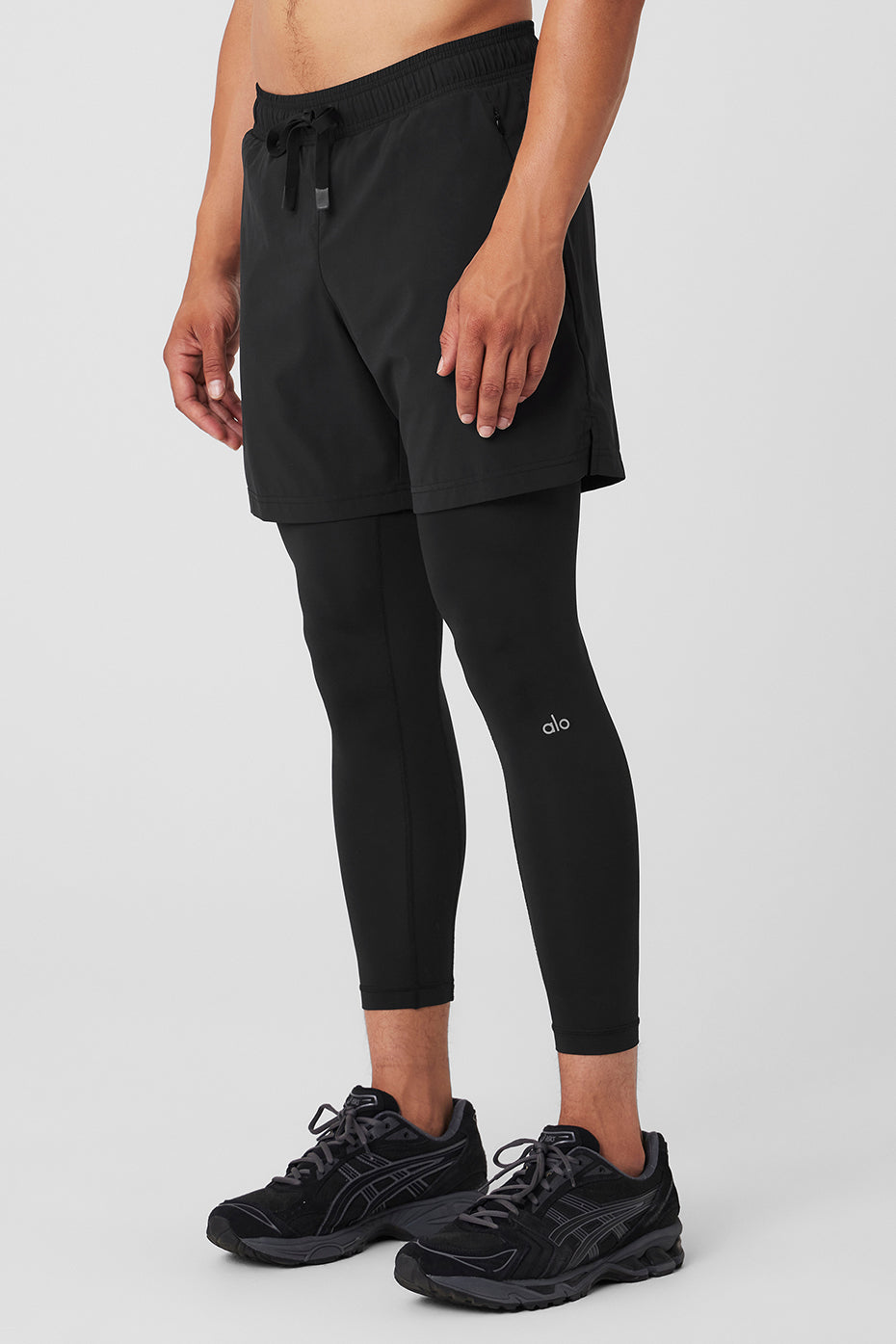 Back view of mens workout pants demonstrating full range of motion during squats