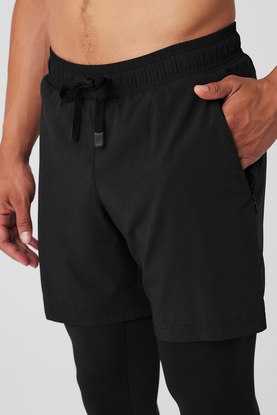 Front angle of Momentum DualFlex pants showing ribbed panels and waistband fit