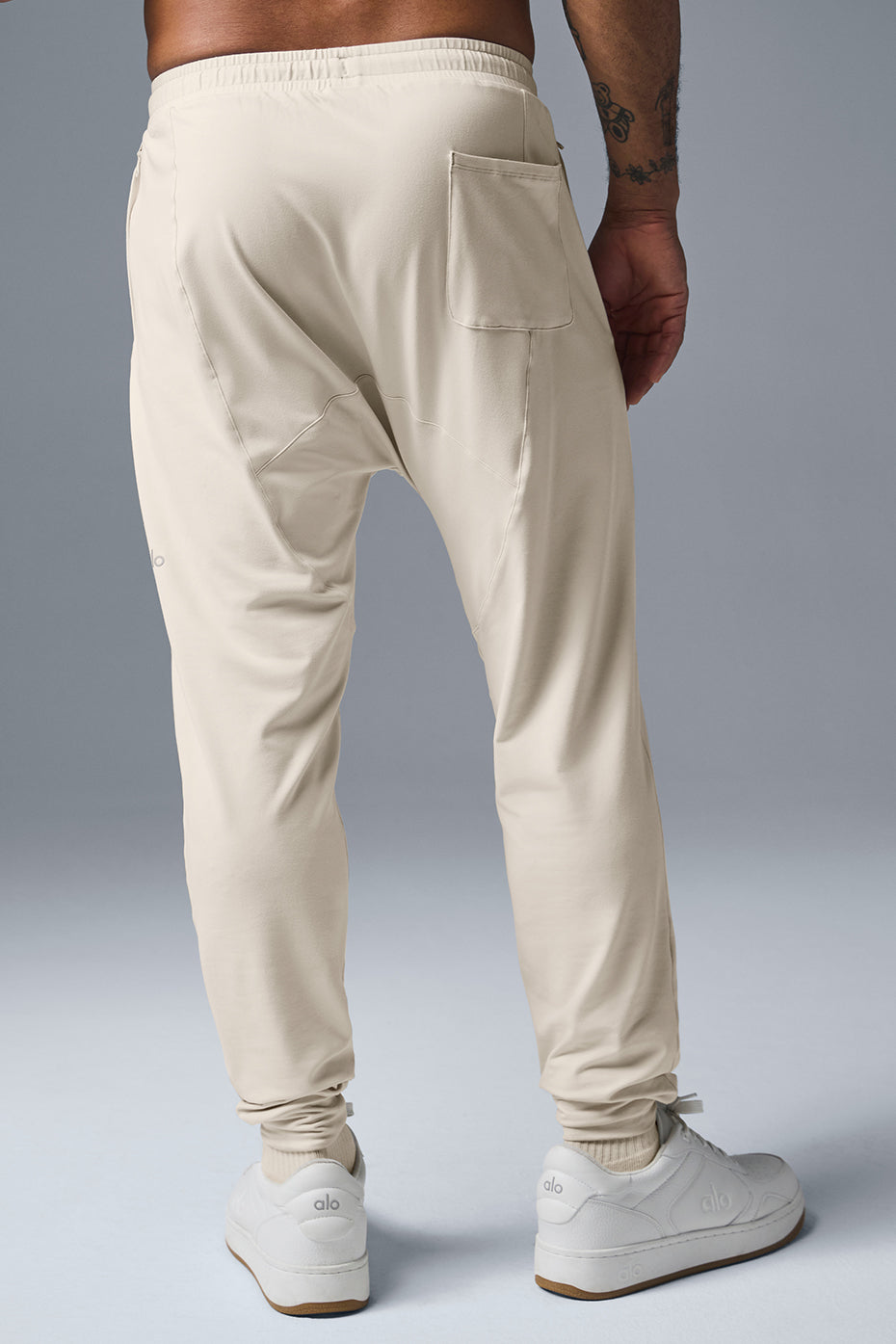 Side angle of Urban Revive Yoga Pants, highlighting the moisture-wicking fabric and elastic waistband.