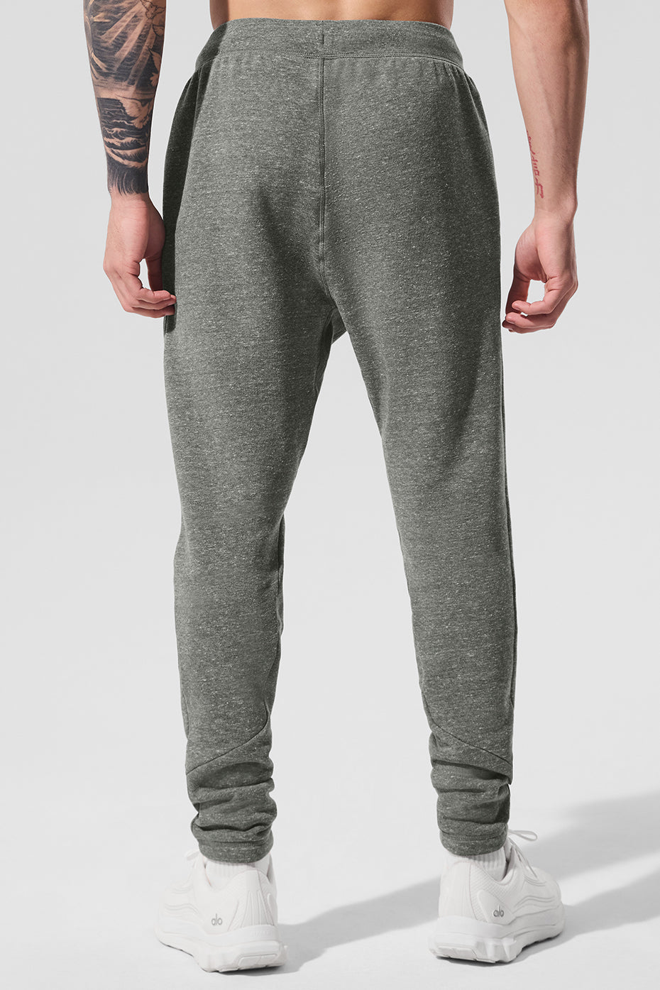 Lifestyle shot of a man wearing grey sweatpants during workout at the gym