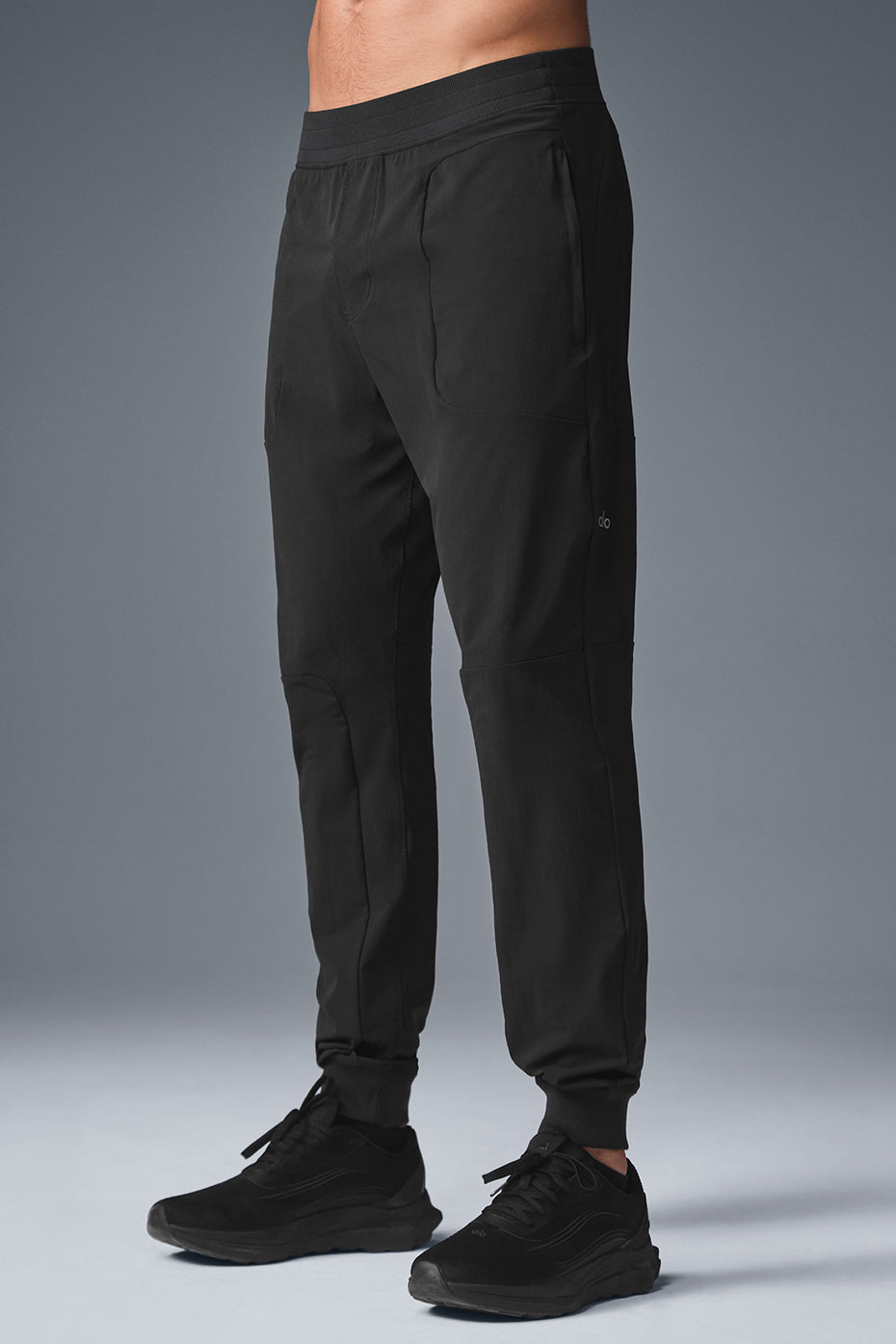 Close-up of the elevated seaming on black activewear pants.