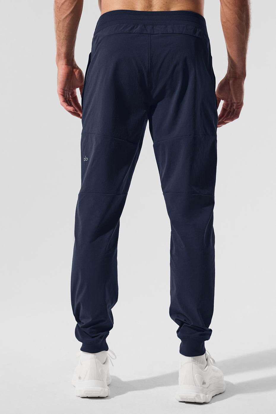 Close-up of water-repellent fabric on mens performance pants.