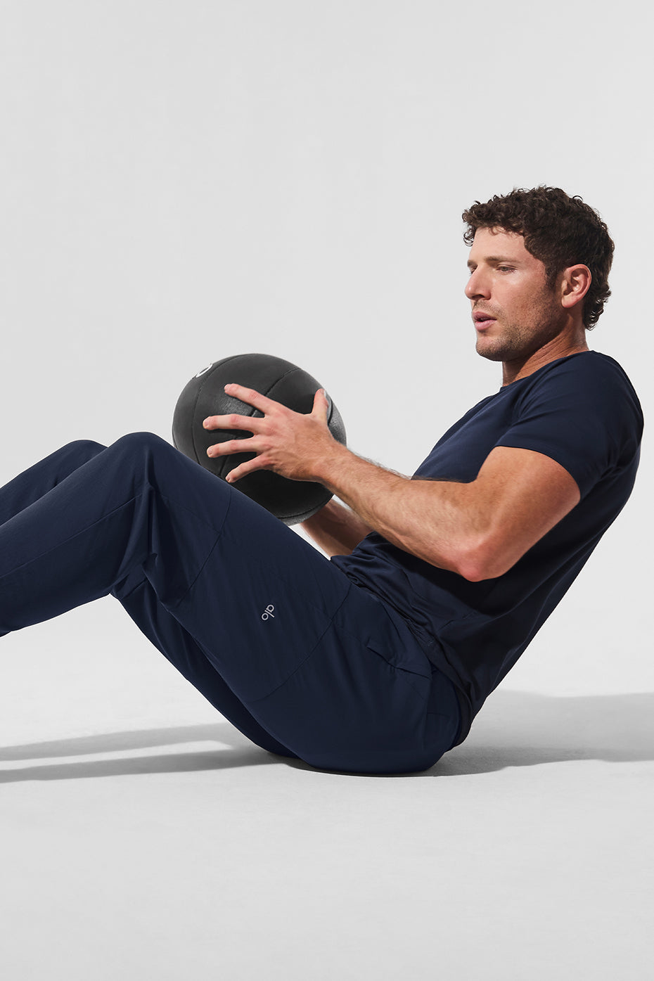 Close-up of water-repellent fabric on mens performance pants.