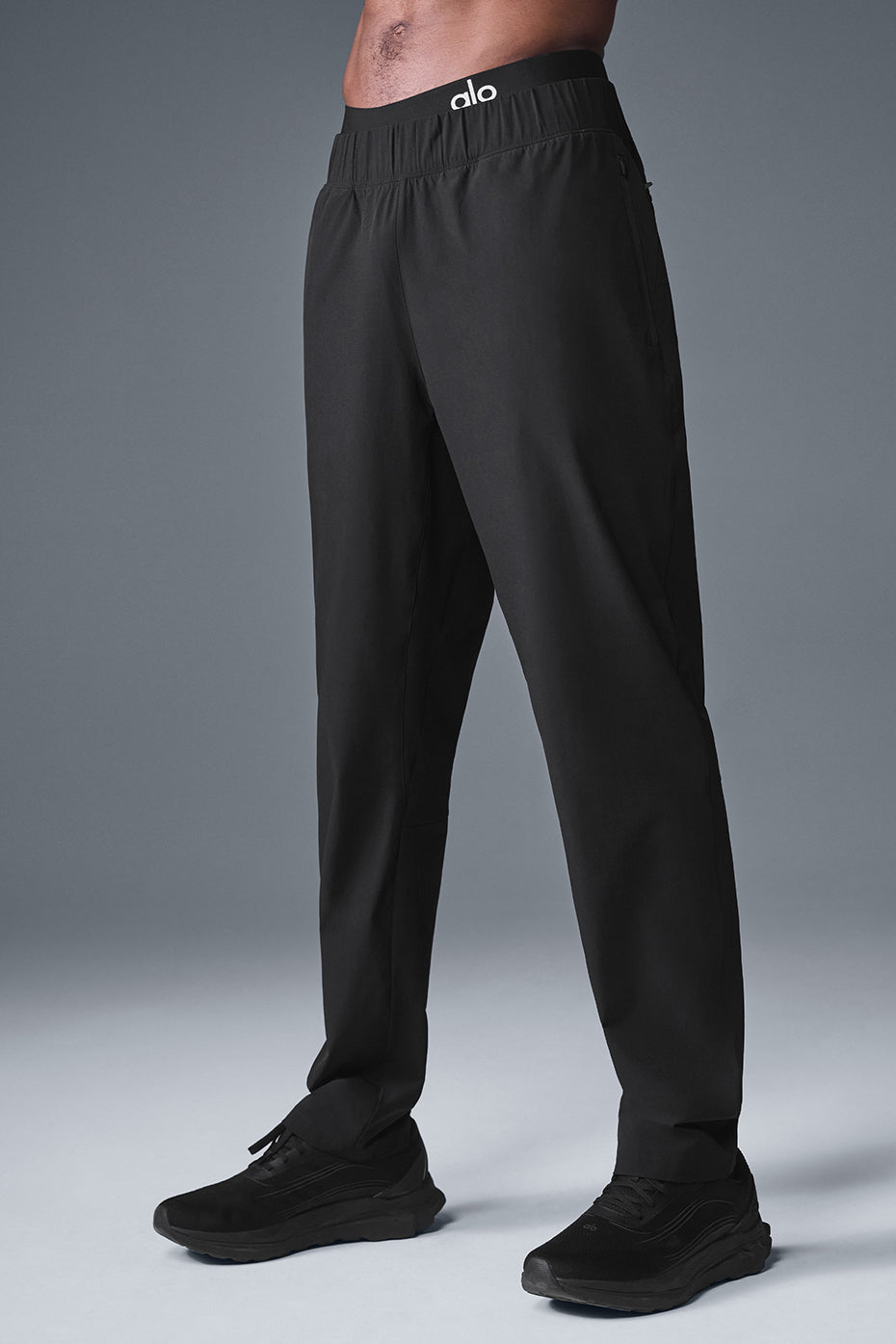 Casual street style with black joggers, showcasing versatility.