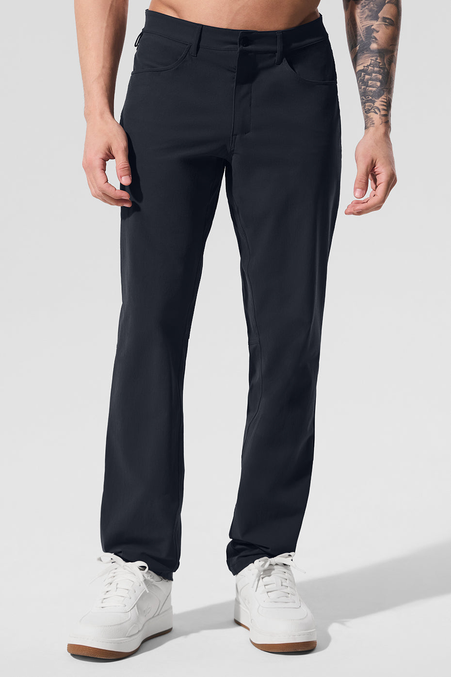 Side view of versatile performance pants in dark navy, showcasing the tailored fit.