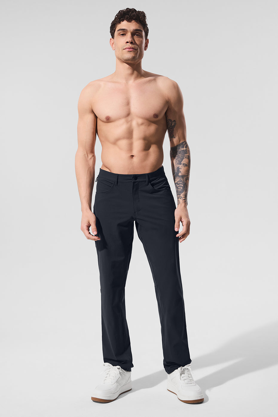 Side view of versatile performance pants in dark navy, showcasing the tailored fit.