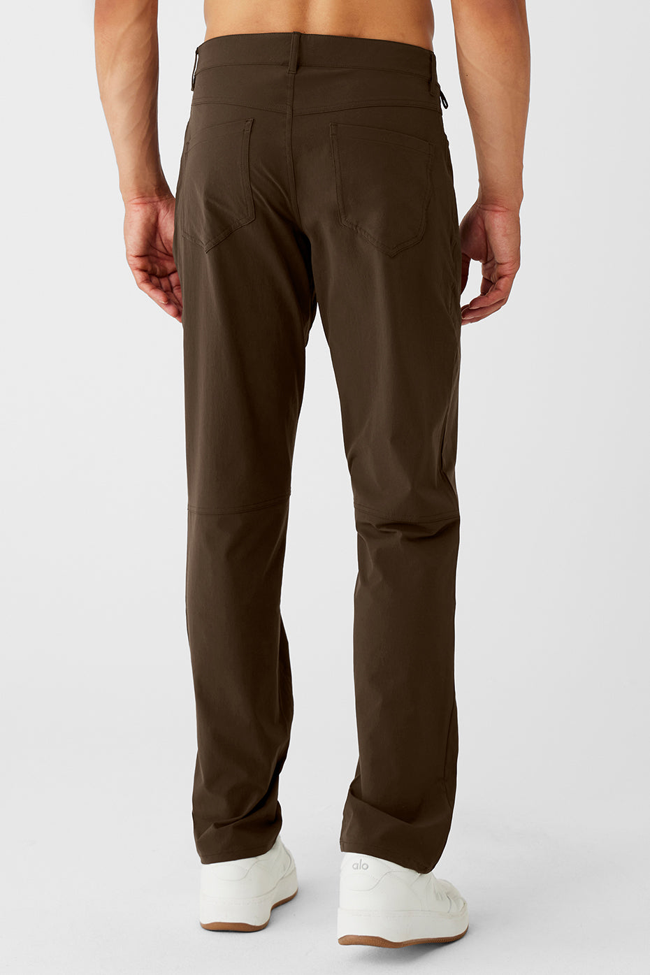 Stylish outfit featuring espresso day and night pants paired with a neutral top