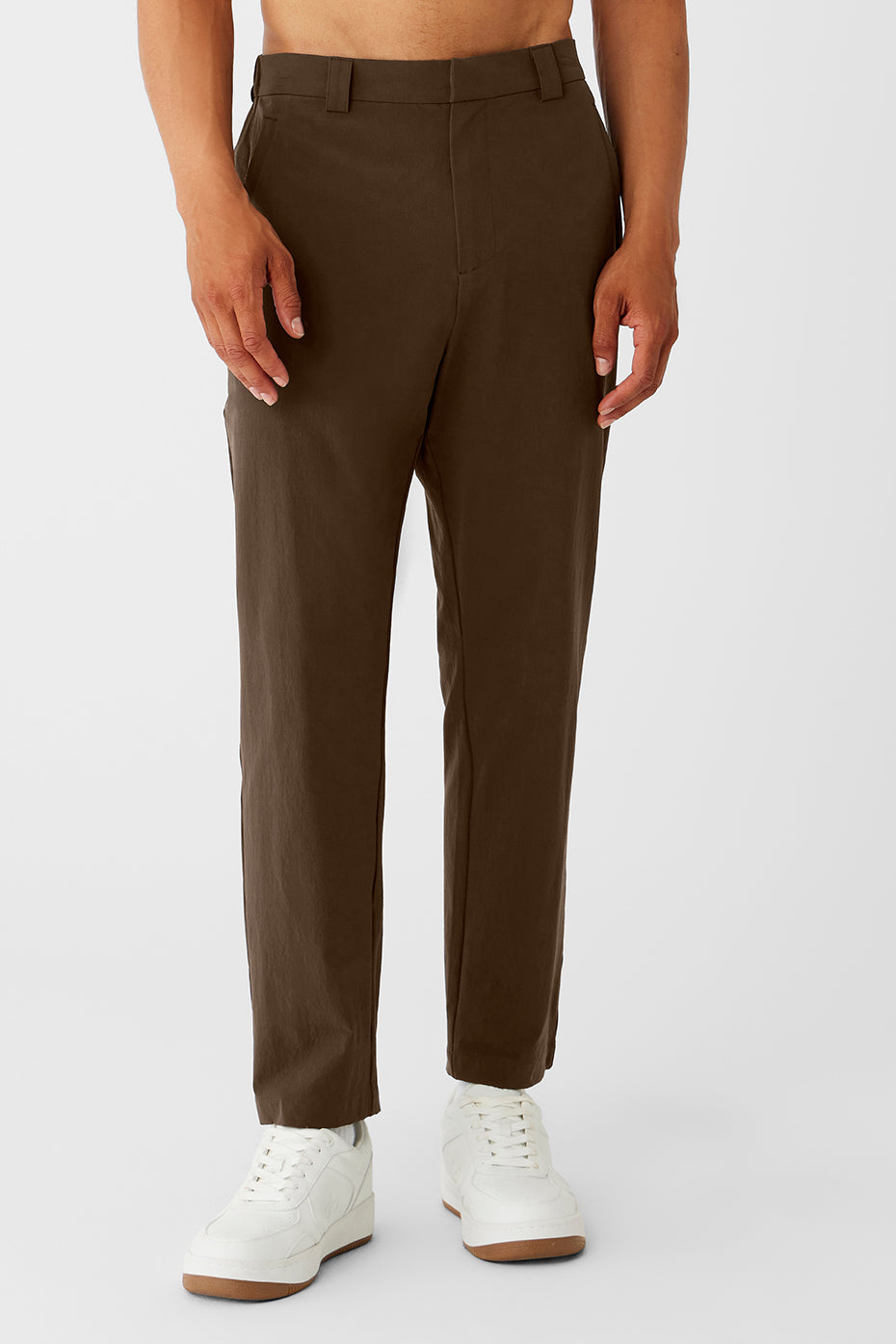 Close-up of the black cropped trousers featuring elevated seams and belt loops