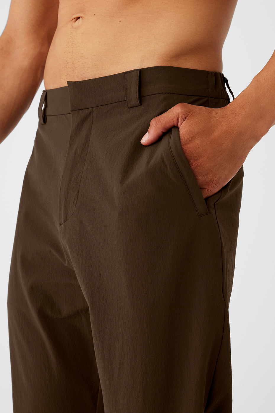 Close-up of the black cropped trousers featuring elevated seams and belt loops