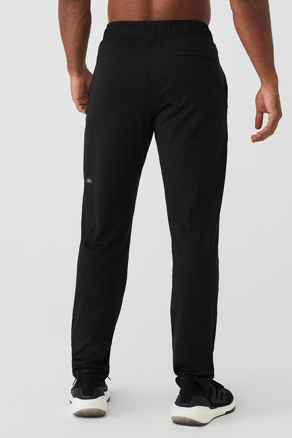 Model wearing Conquer Pulse performance pants during a workout session