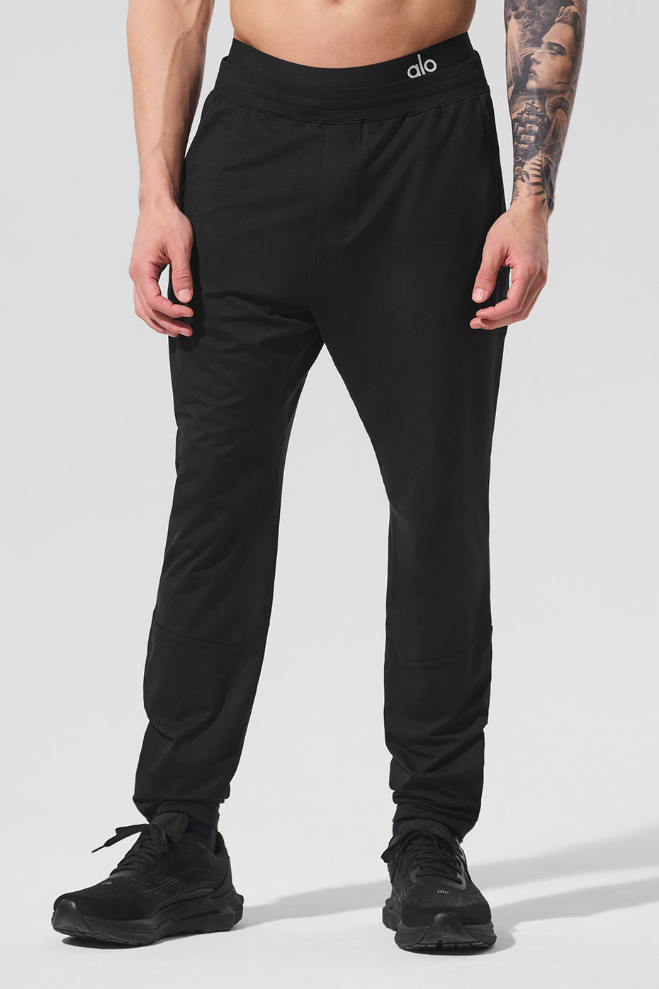 Front view of Conquer React Performance Pants in black, showcasing the breathable fabric.