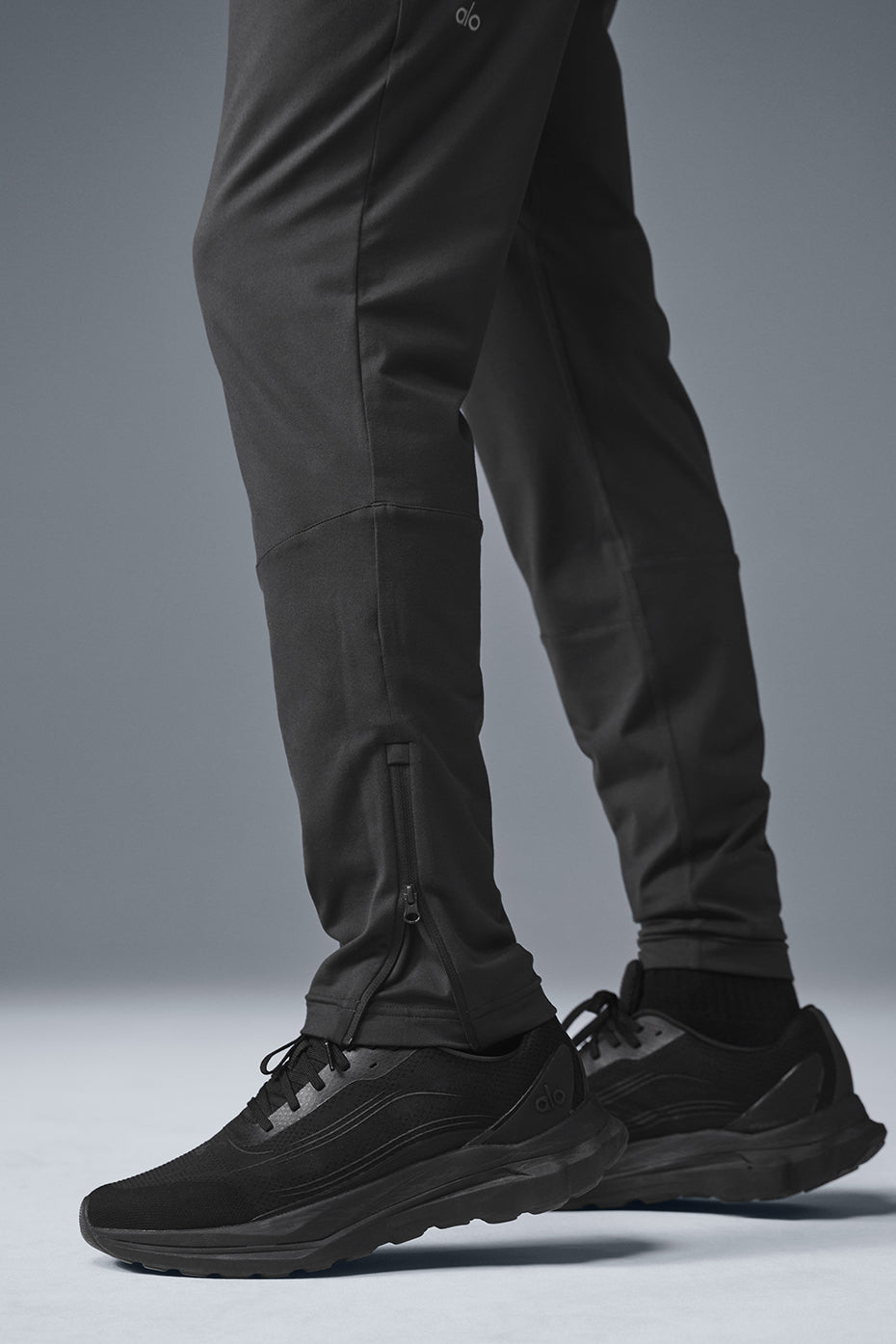 Mens performance pants in anthracite color showing breathable fabric and modern fit